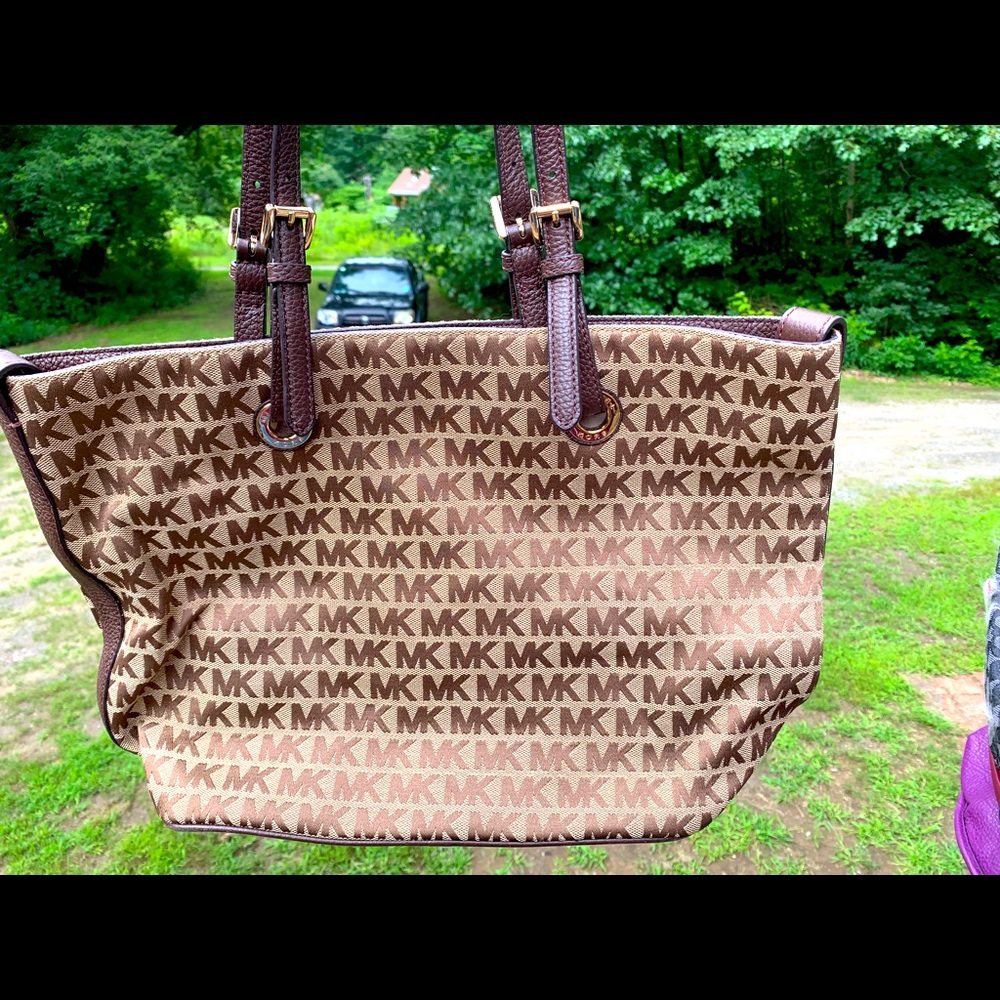 Lightly used Michael Kors purse with MK print.